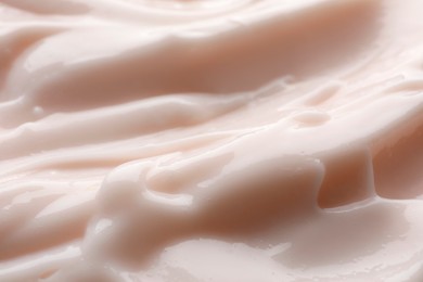 Photo of Texture of face cream as background, closeup view