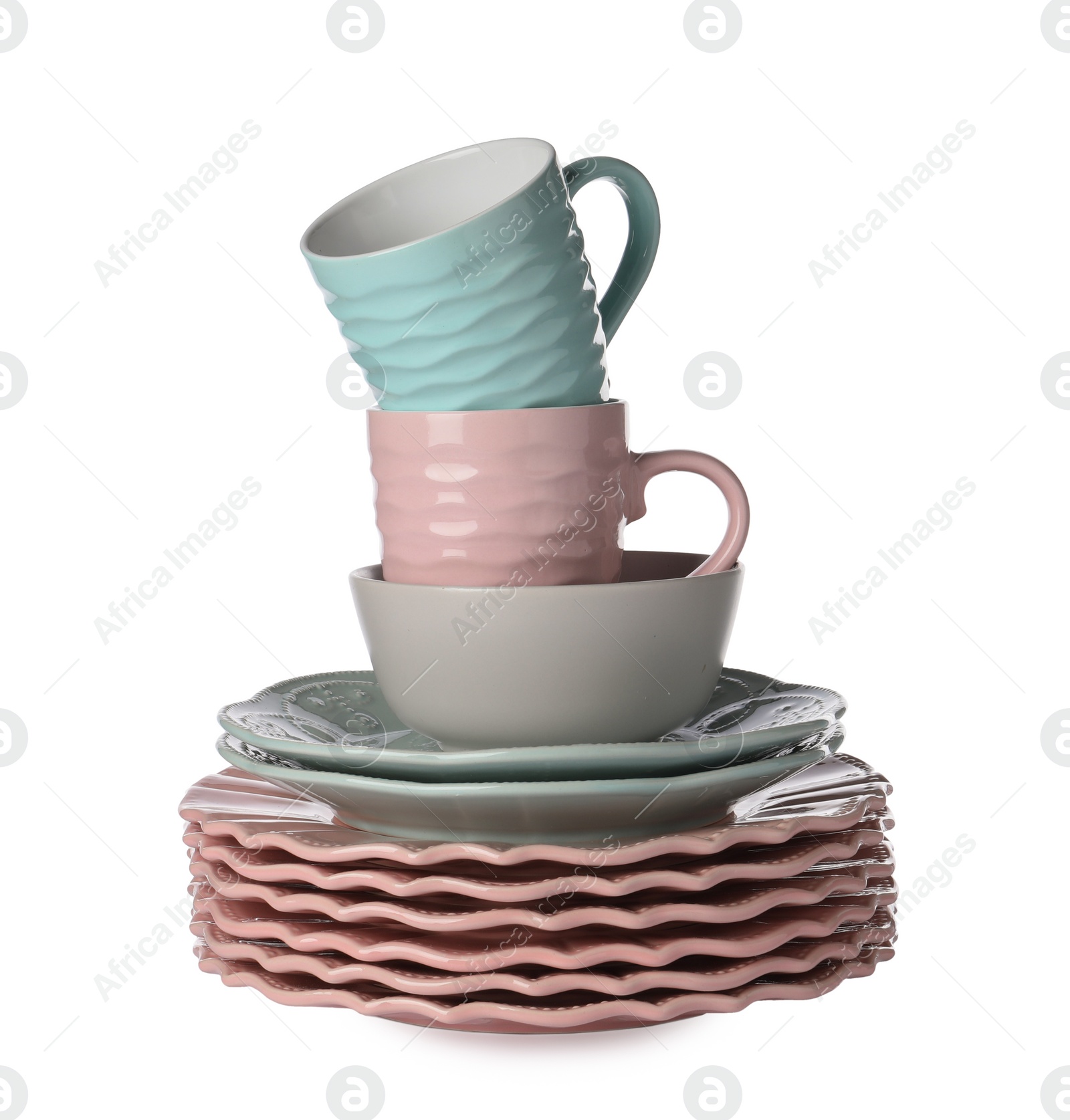 Photo of Beautiful ceramic plates, bowl and cups isolated on white