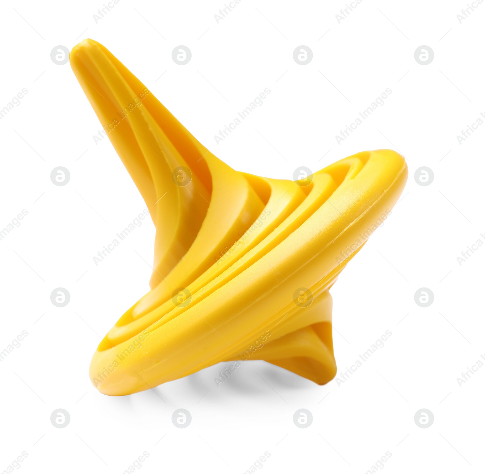 Photo of One yellow spinning top on white background