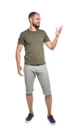 Photo of Full length portrait of man in casual clothes on white background