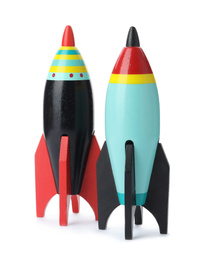 Photo of Bright modern toy rockets isolated on white. Back to school