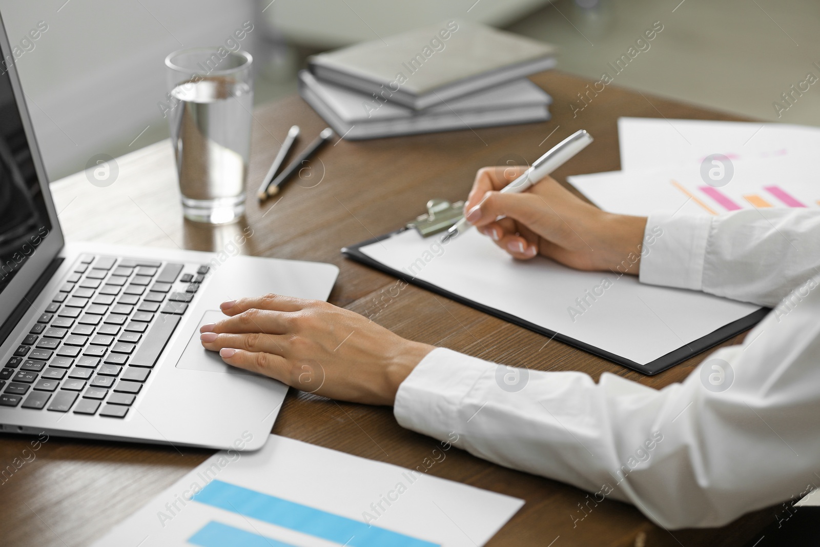 Photo of Business trainer working at table in office, closeup