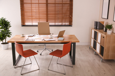 Director's office with large wooden table. Interior design