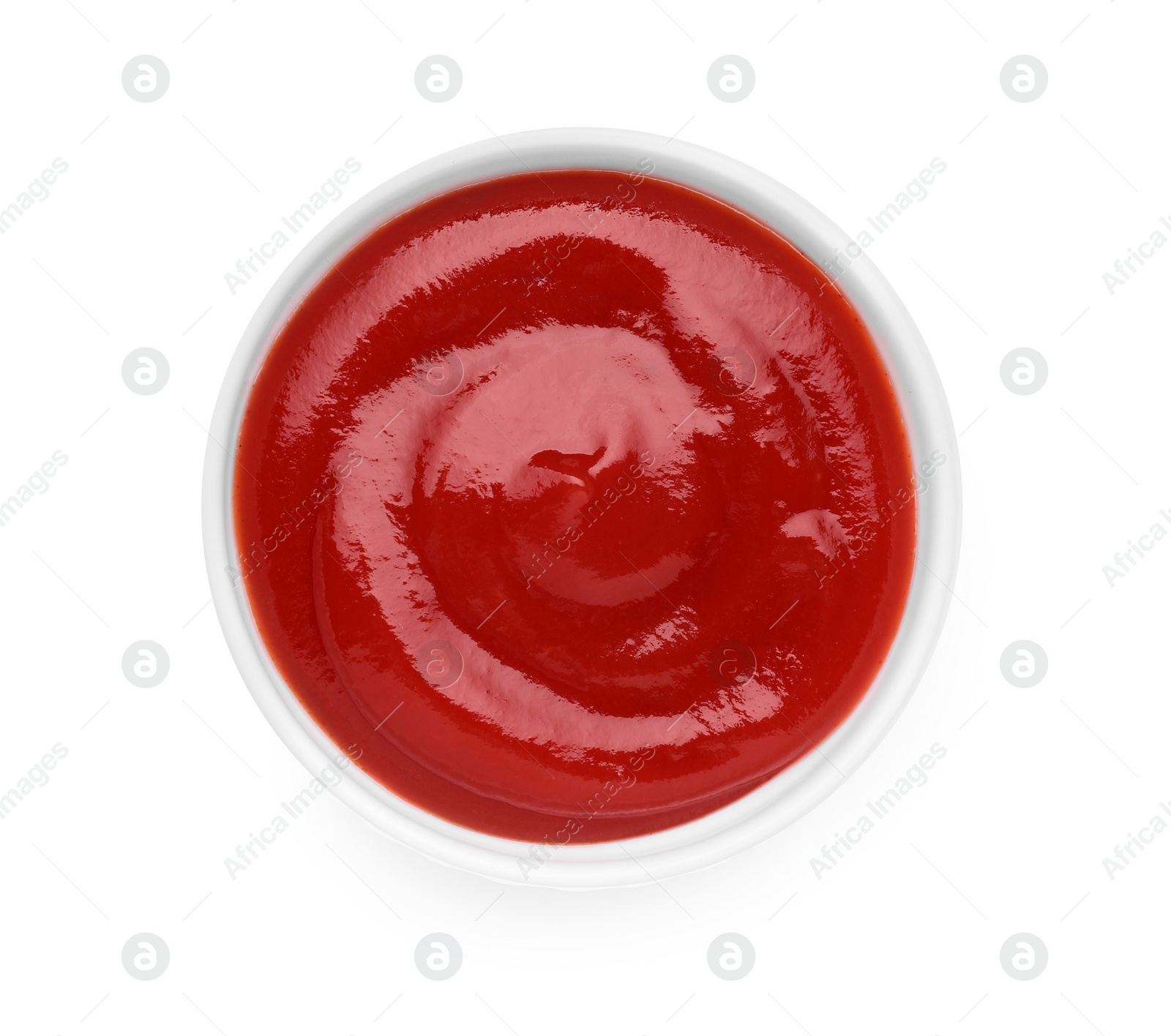 Bowl of tasty ketchup isolated on white, top view. Tomato sauce Photo of Bowl of tasty ketchup isolated on white, top view. Tomato sauce