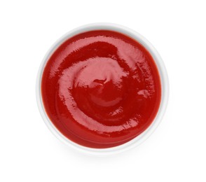 Photo of Bowl of tasty ketchup isolated on white, top view. Tomato sauce