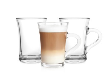 Image of Empty glass cups and one with aromatic coffee on white background