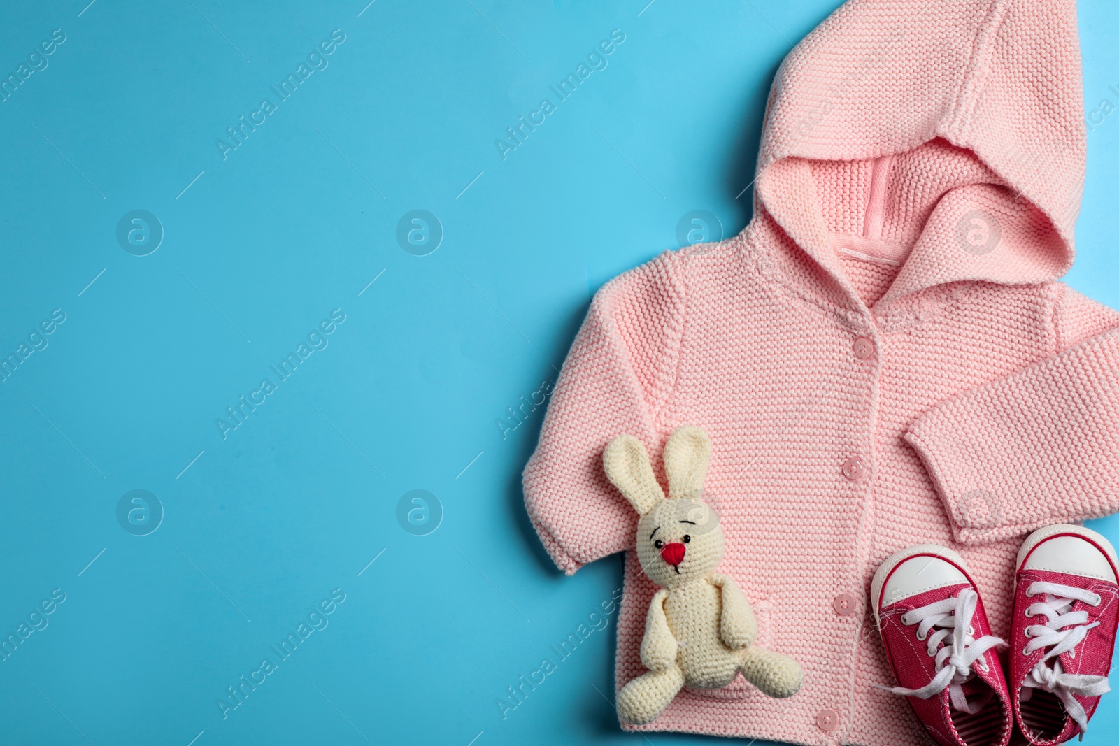 Photo of Flat lay composition with baby accessories on color background. Space for text