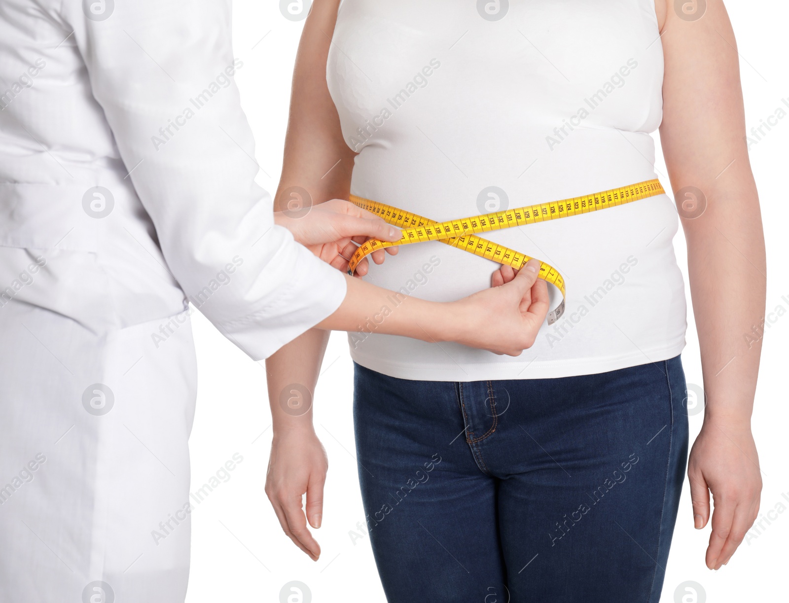 Photo of Doctor measuring waist of overweight woman isolated on white, closeup