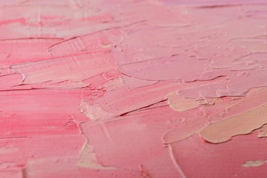 Photo of Beautiful strokes of pink and white oil paints as background, closeup