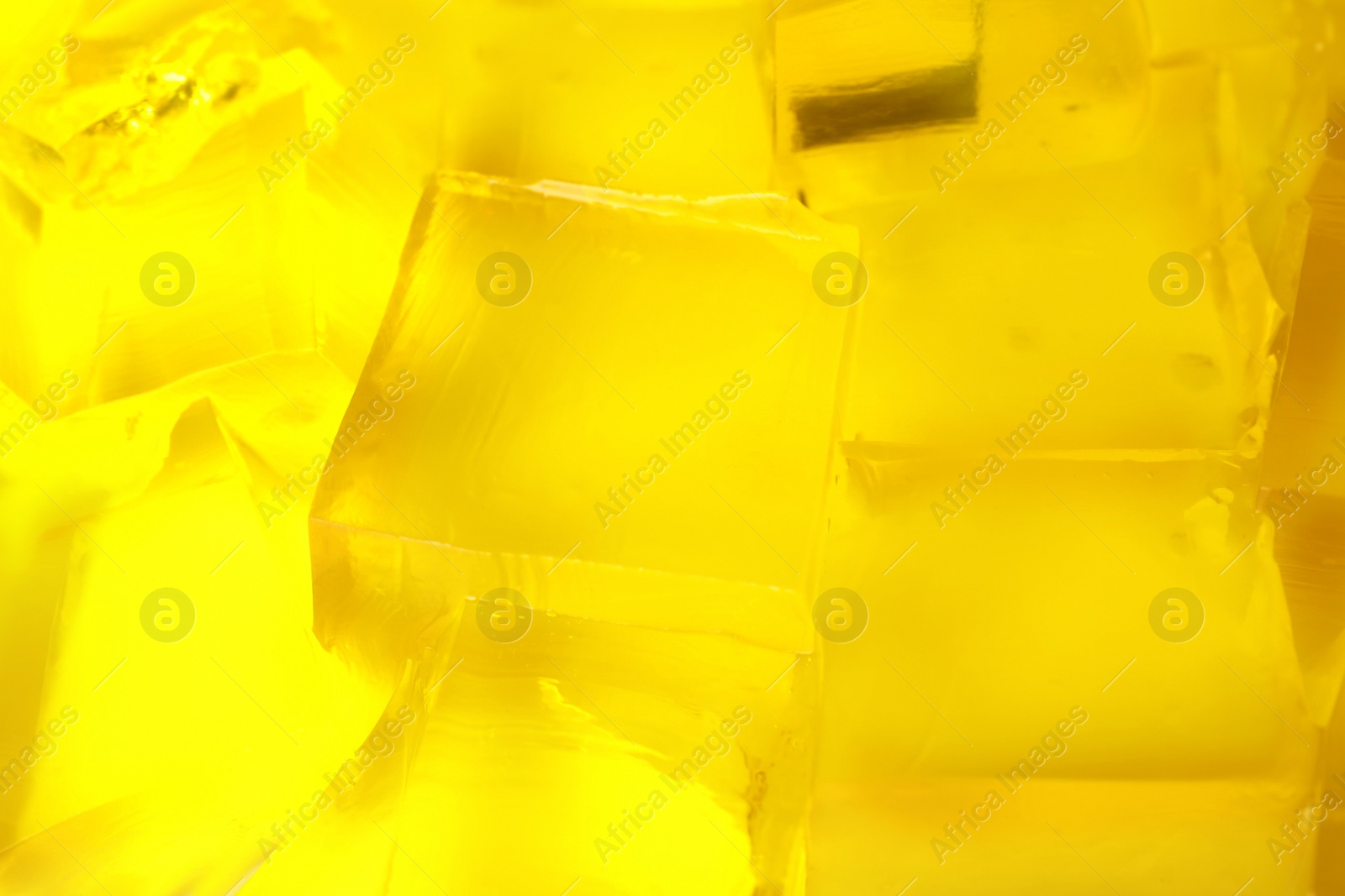 Photo of Tasty natural jelly cubes as background, closeup