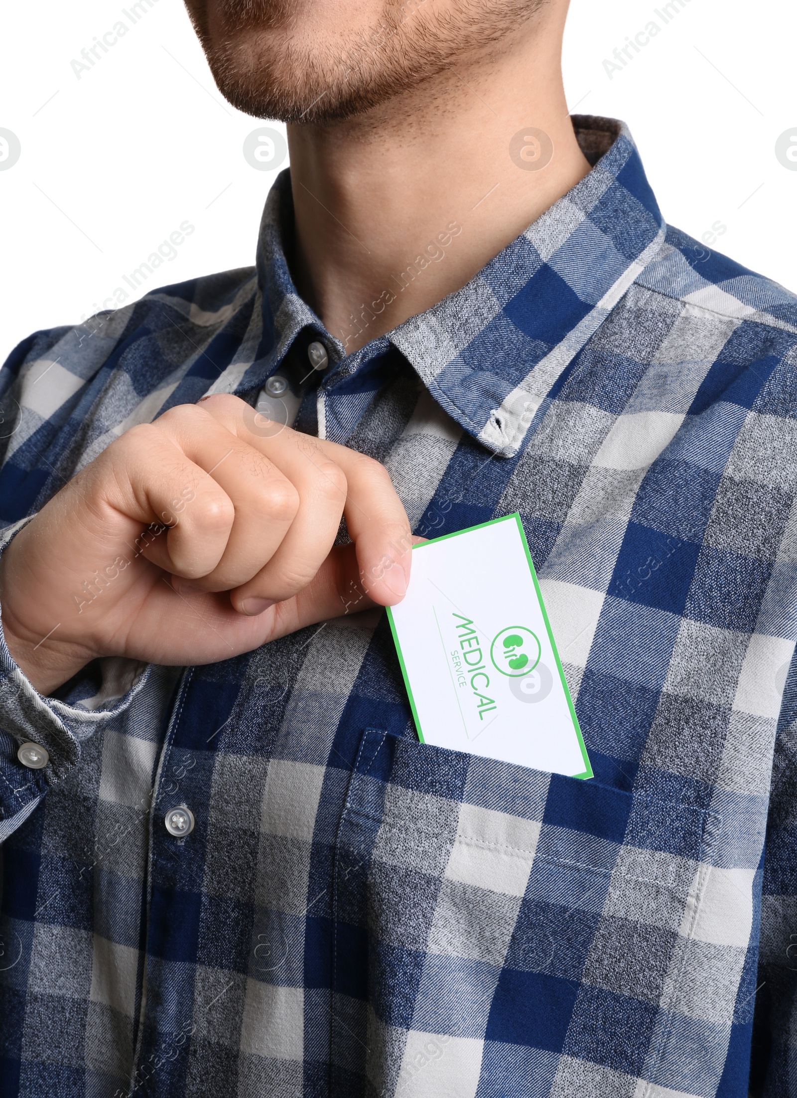 Photo of Man putting medical business card into pocket, closeup. Nephrology service