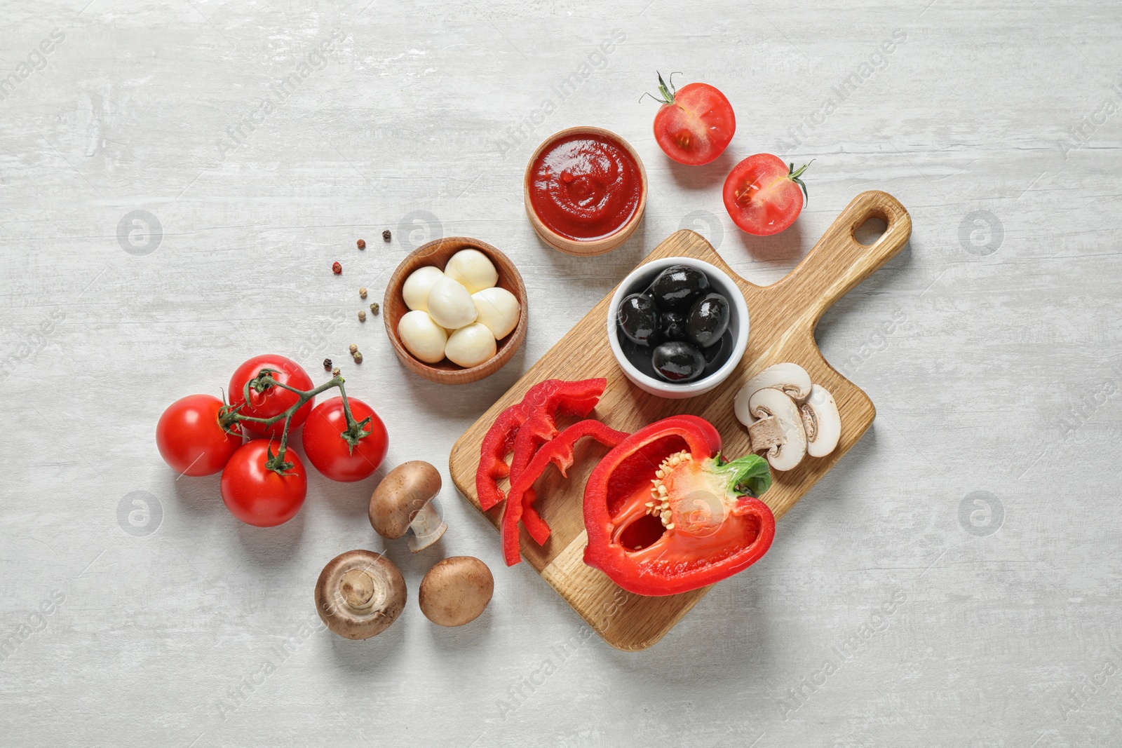 Photo of Flat lay composition with fresh ingredients for pizza on white wooden table