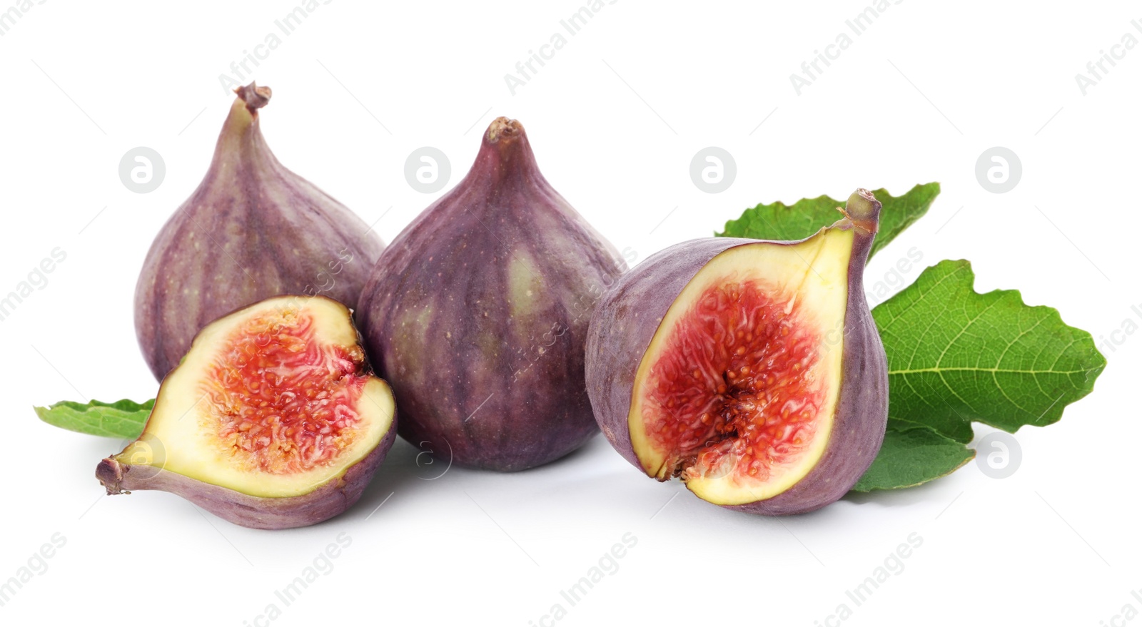 Photo of Tasty whole and cut figs with green leaf isolated on white