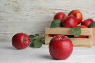 Photo of Composition with juicy red apples on table. Space for text