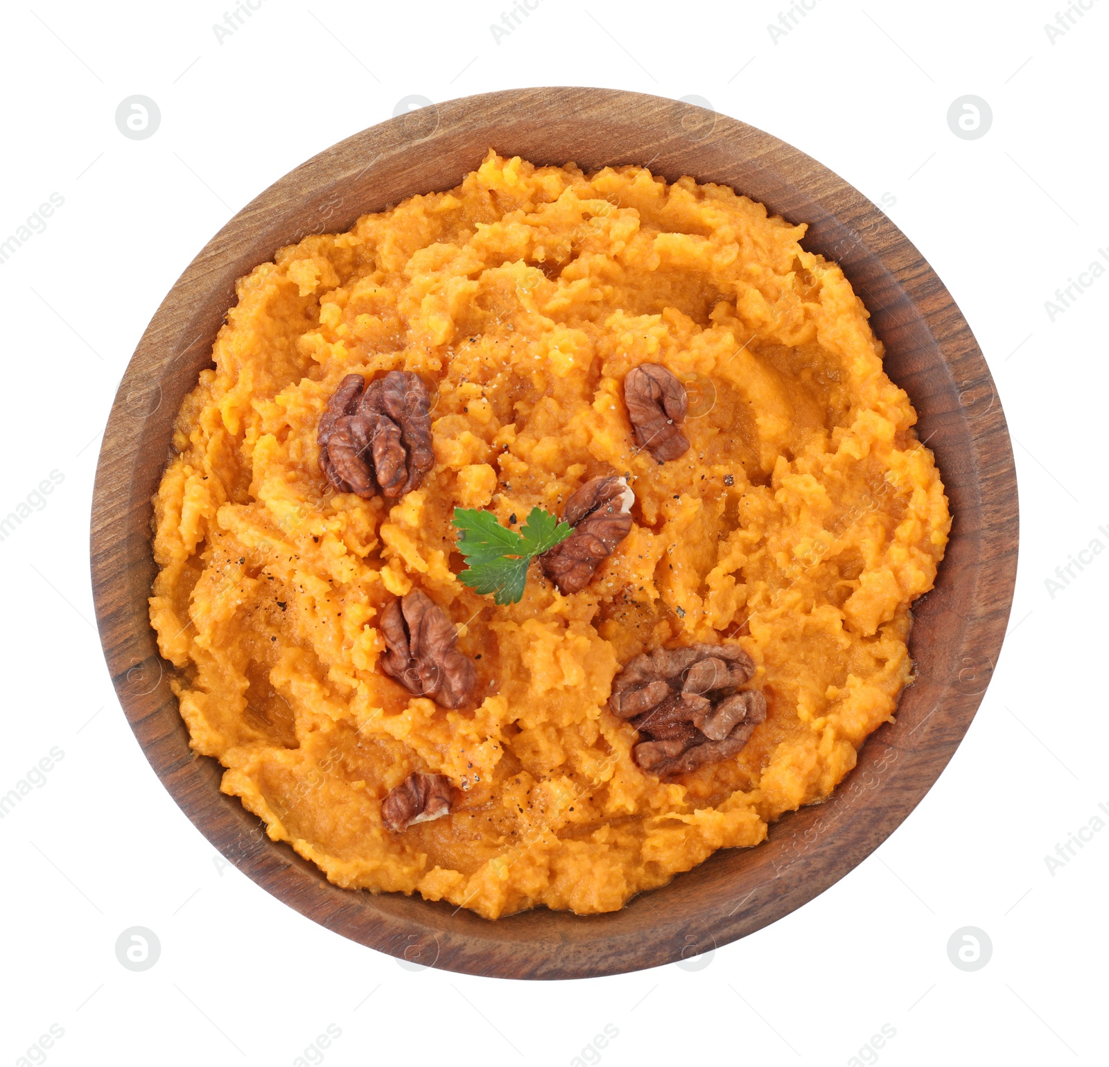 Photo of Bowl with mashed sweet potatoes on white background, top view