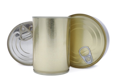 Many closed tin cans on white background