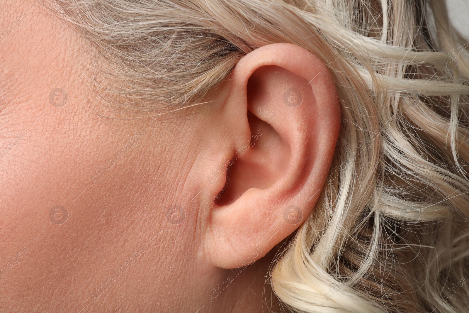 Photo of Closeup view of woman, focus on ear