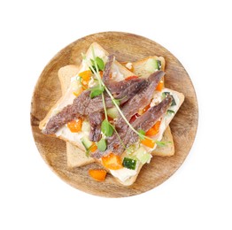 Delicious toasts with anchovies, cream cheese, bell peppers and cucumbers isolated on white, top view