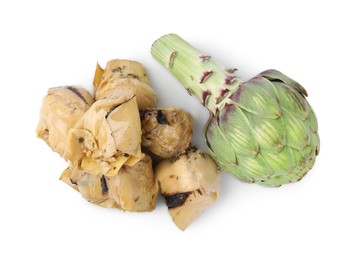 Delicious pickled artichokes and fresh vegetable on white background, top view