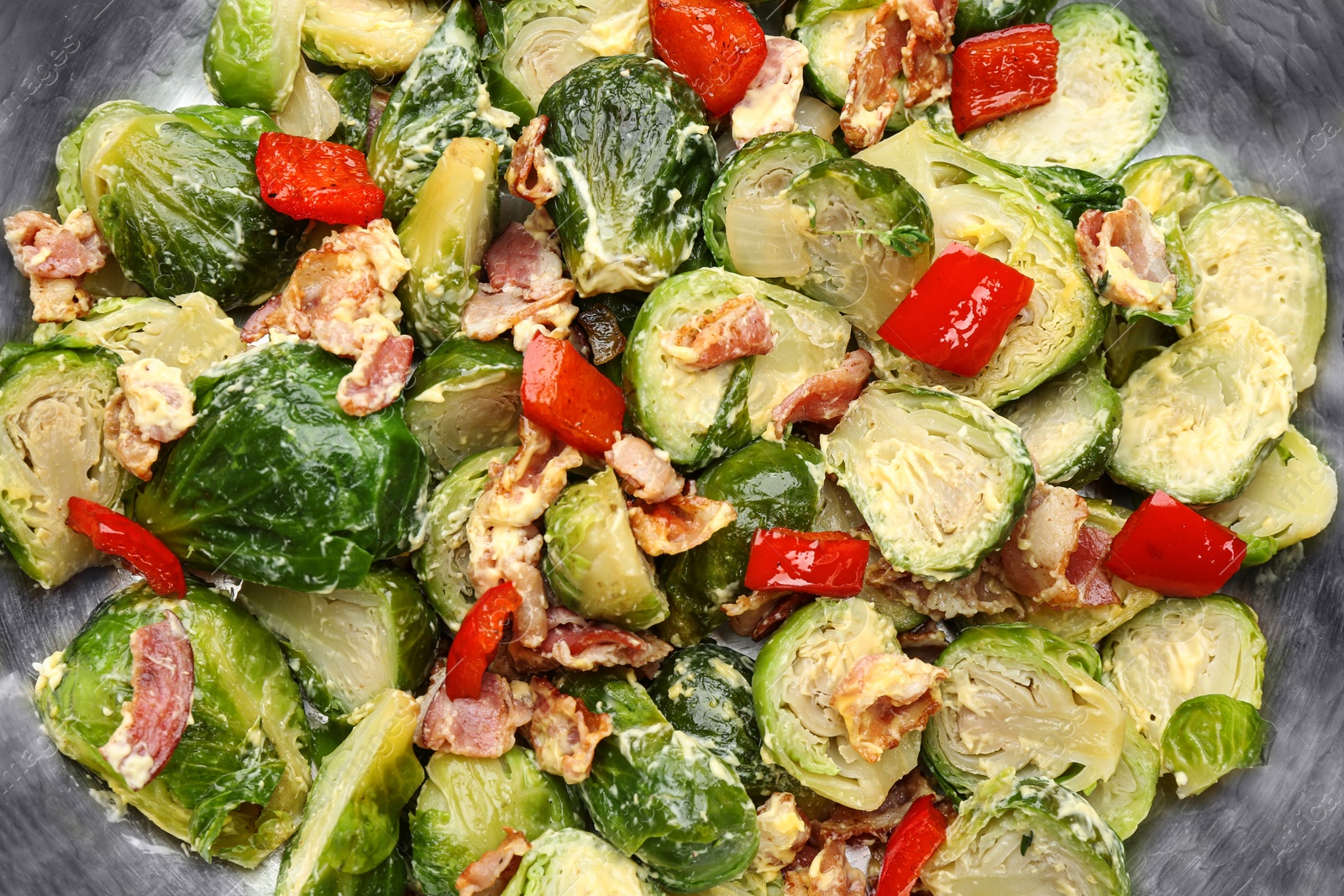 Photo of Delicious cooked Brussels sprouts with bacon in pan, closeup