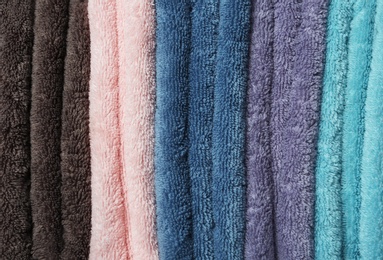 Different soft terry towels as background, closeup