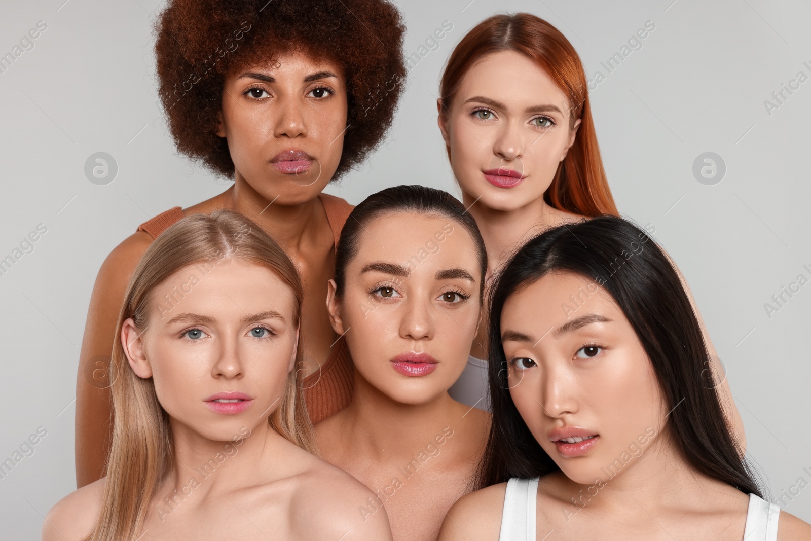 Photo of Portrait of beautiful young women on light grey background