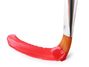 Photo of Brush with color paint and stroke on white background