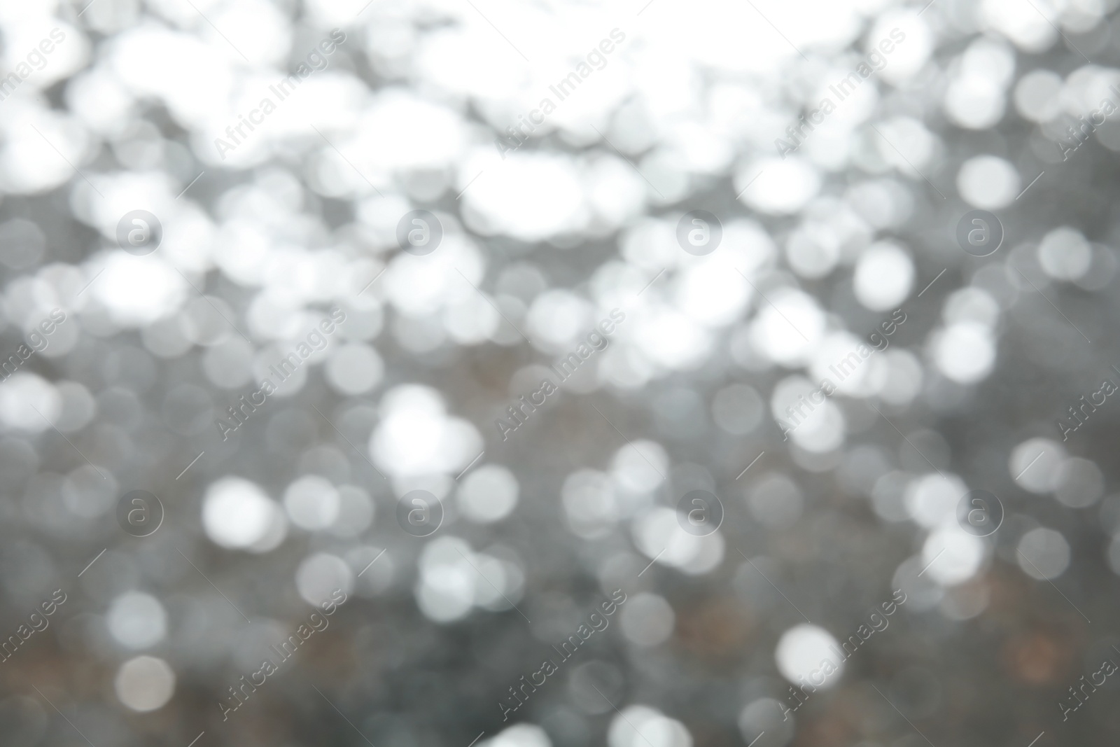 Photo of Blurred view of color glitter as background