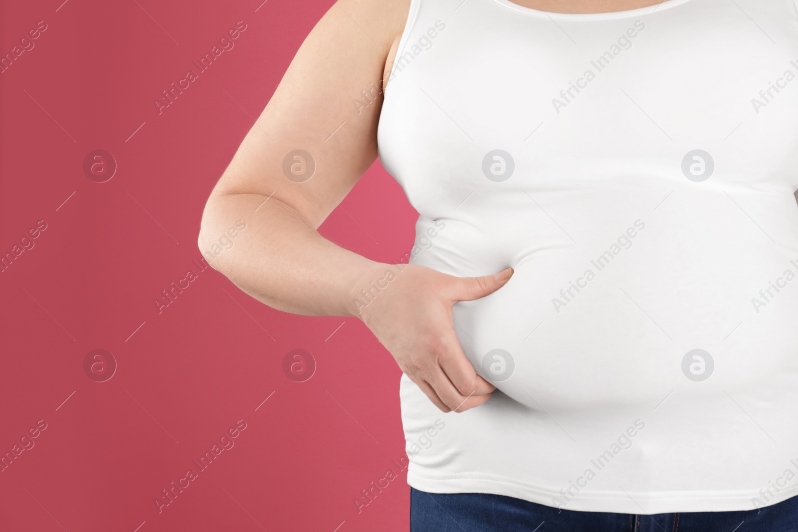 Photo of Overweight woman on color background, closeup. Space for text