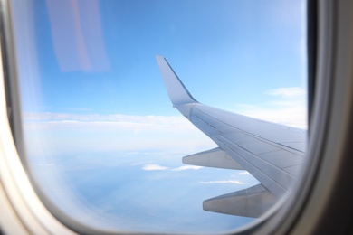 Image of Beautiful view through plane window during flight. Air travel