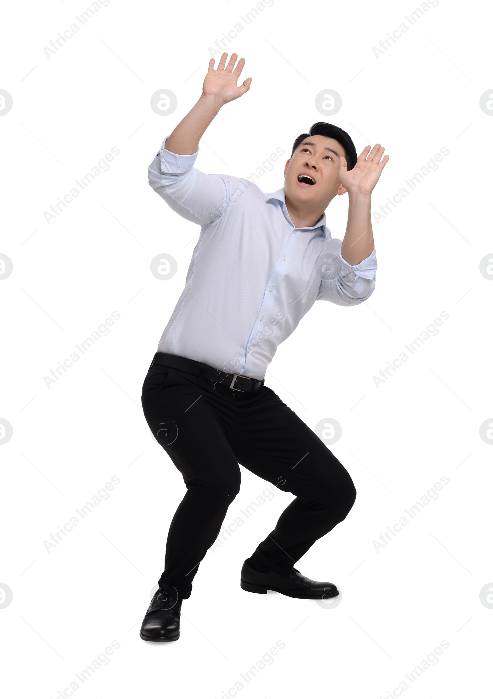 Photo of Scared businessman in formal clothes posing on white background