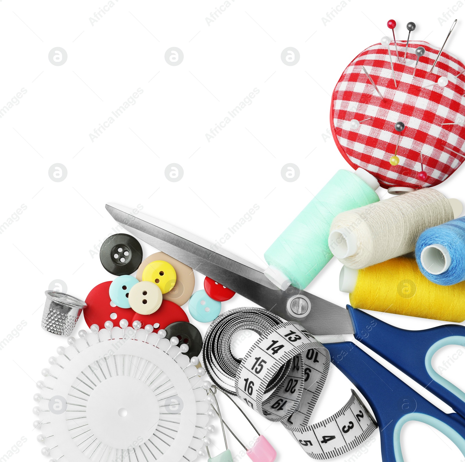 Photo of Set of different sewing accessories on white background, top view