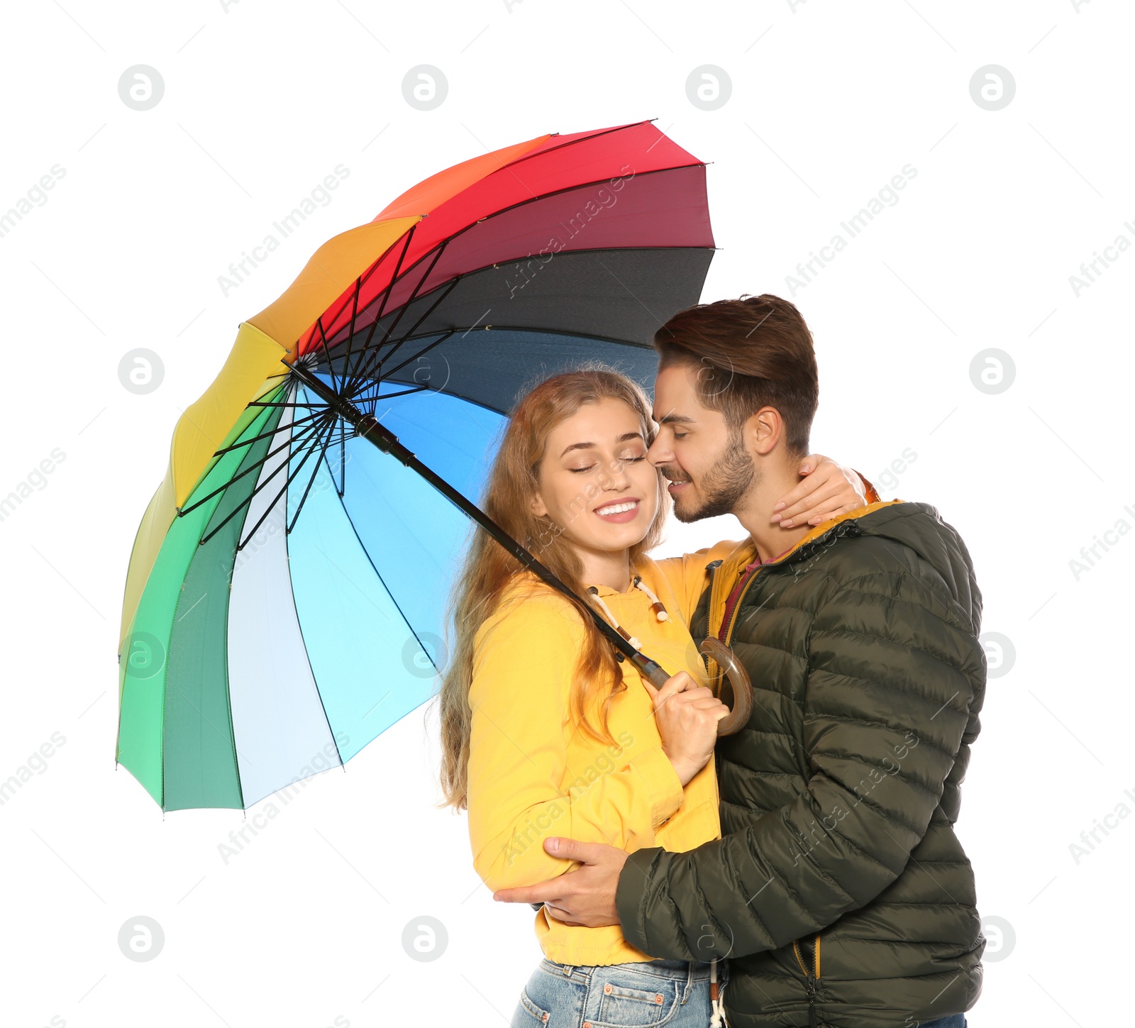 Photo of Young romantic couple with bright umbrella on white background