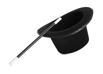 Photo of Black top hat and wand isolated on white. Magician equipment