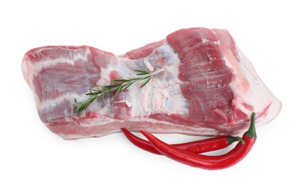 One piece of raw pork belly, chili pepper and rosemary isolated on white, top view