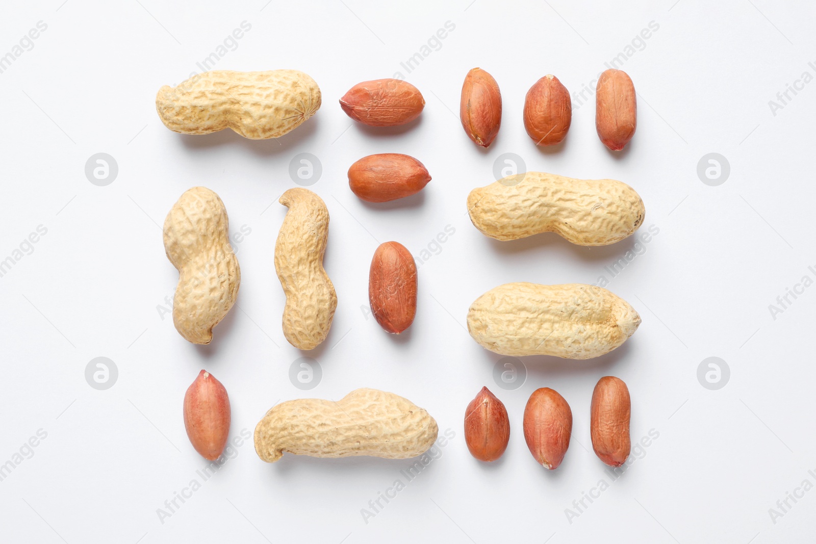 Photo of Fresh peanuts on white background, flat lay