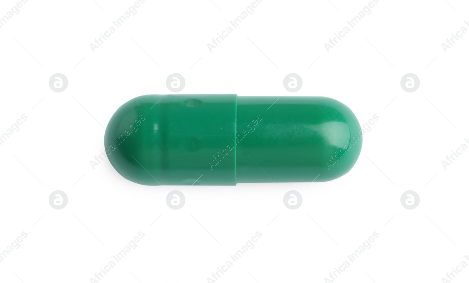 Photo of One pill isolated on white, top view