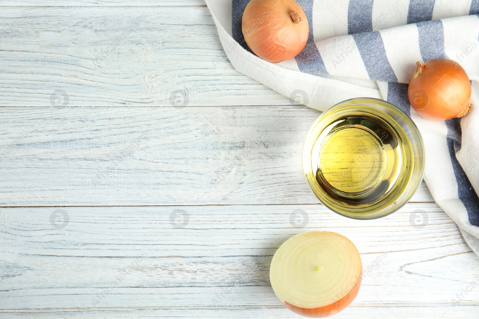 Photo of Flat lay composition with onion syrup in glass and space for text on table