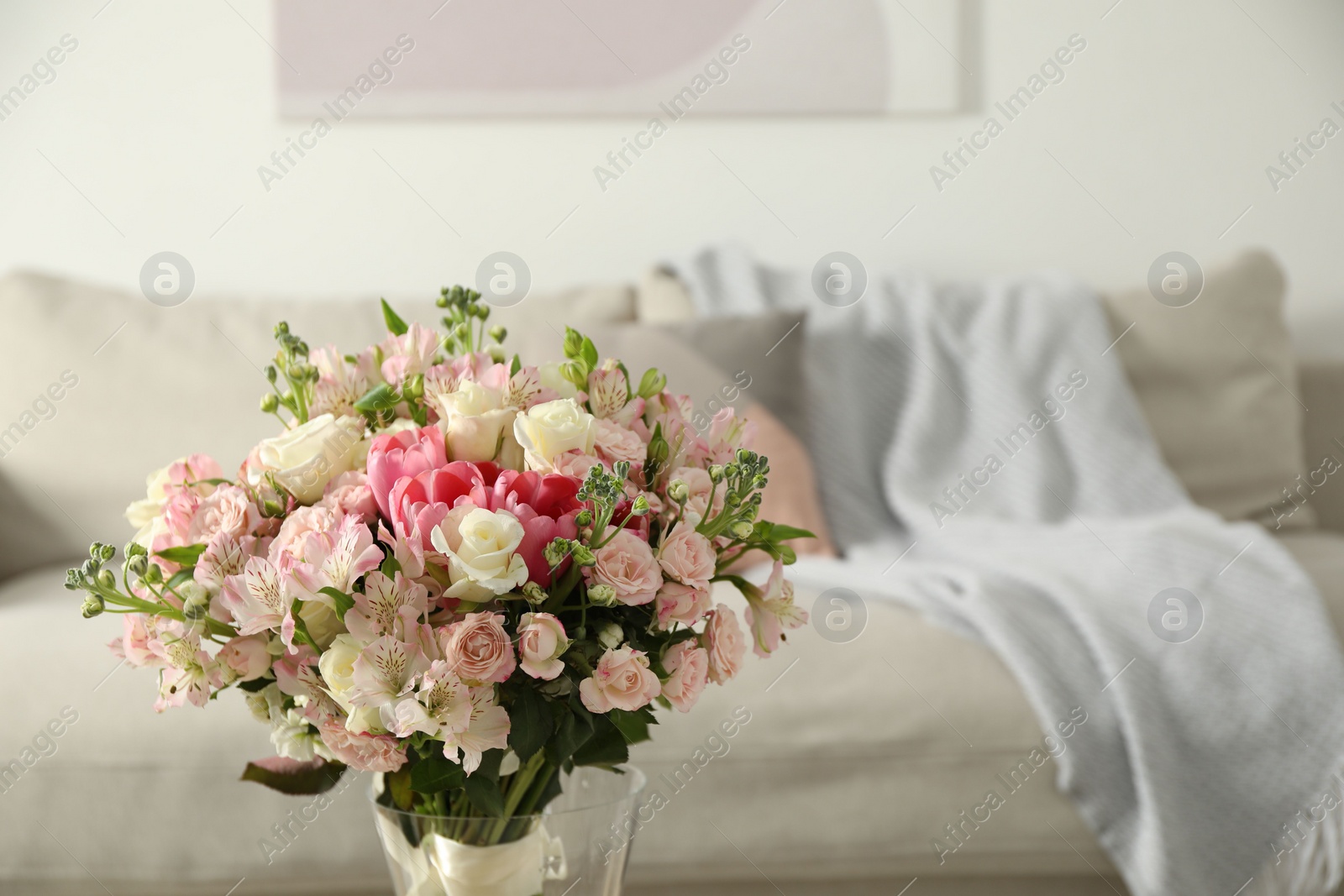 Photo of Beautiful bouquet of fresh flowers in vase indoors, space for text