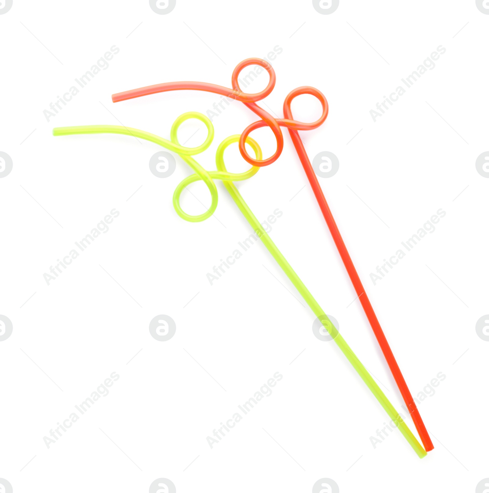 Photo of Color plastic cocktail tubes on white background, top view