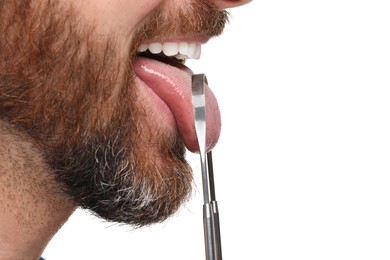 Photo of Man brushing his tongue with cleaner on white background, closeup