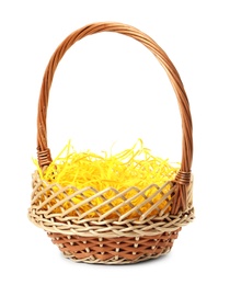 Photo of Wicker basket with yellow filler isolated on white. Easter item