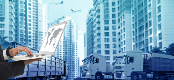 Image of Logistics concept, banner design. Businessman with laptop, closeup. Trucks and buildings on background, toned in blue