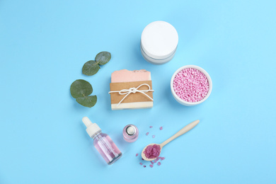Flat lay composition with natural handmade soap on light blue background