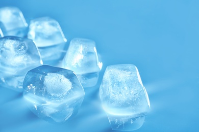 Transparent ice cubes on color mirror surface