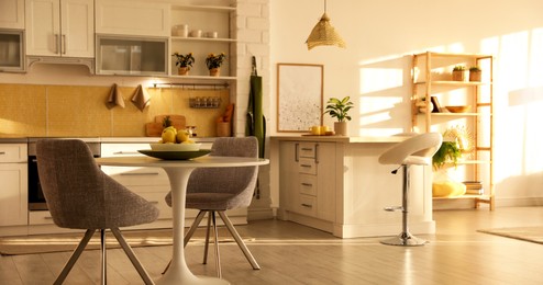 Image of Modern kitchen interior with stylish white furniture. Banner design