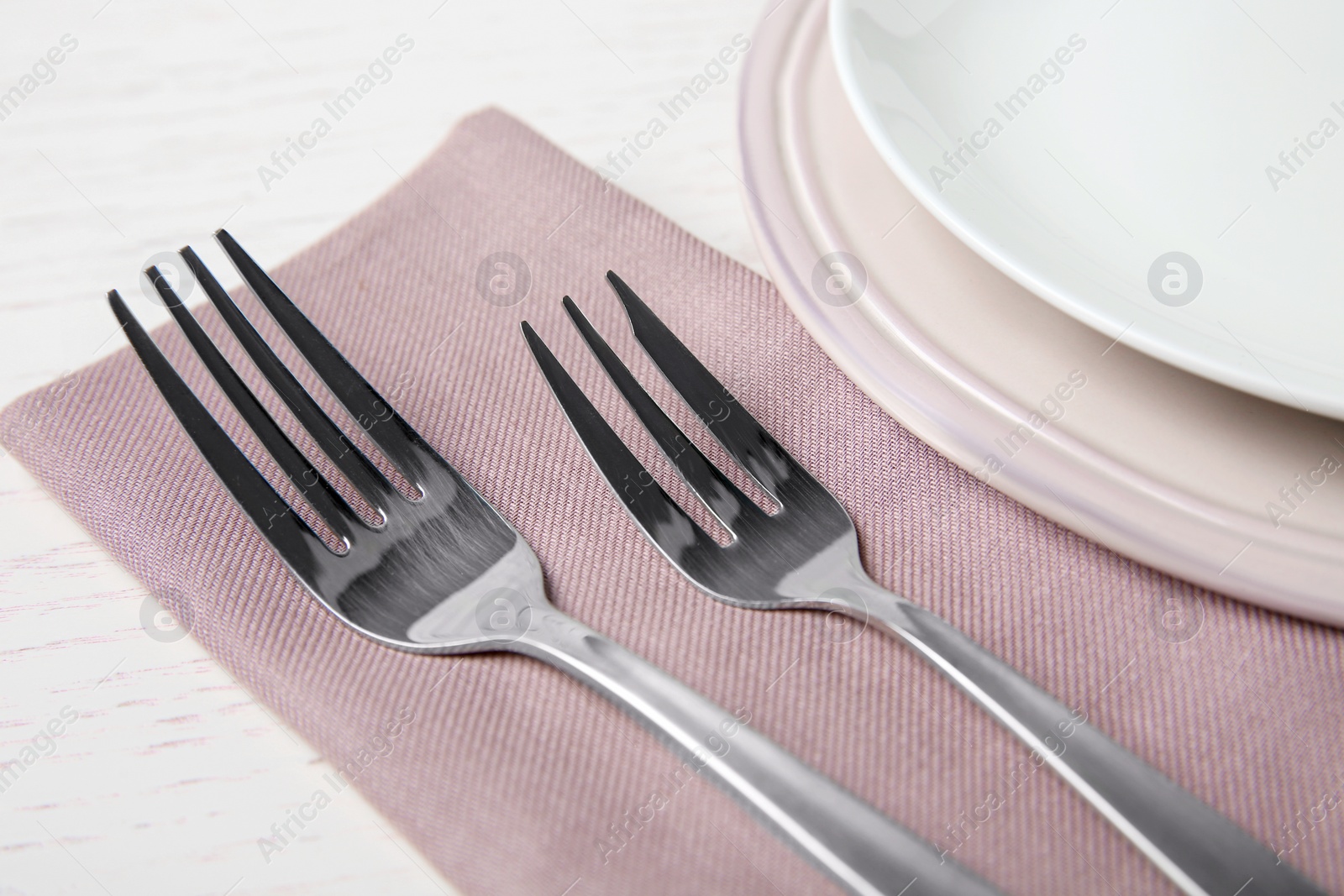 Photo of Beautiful table setting on white wooden background, closeup