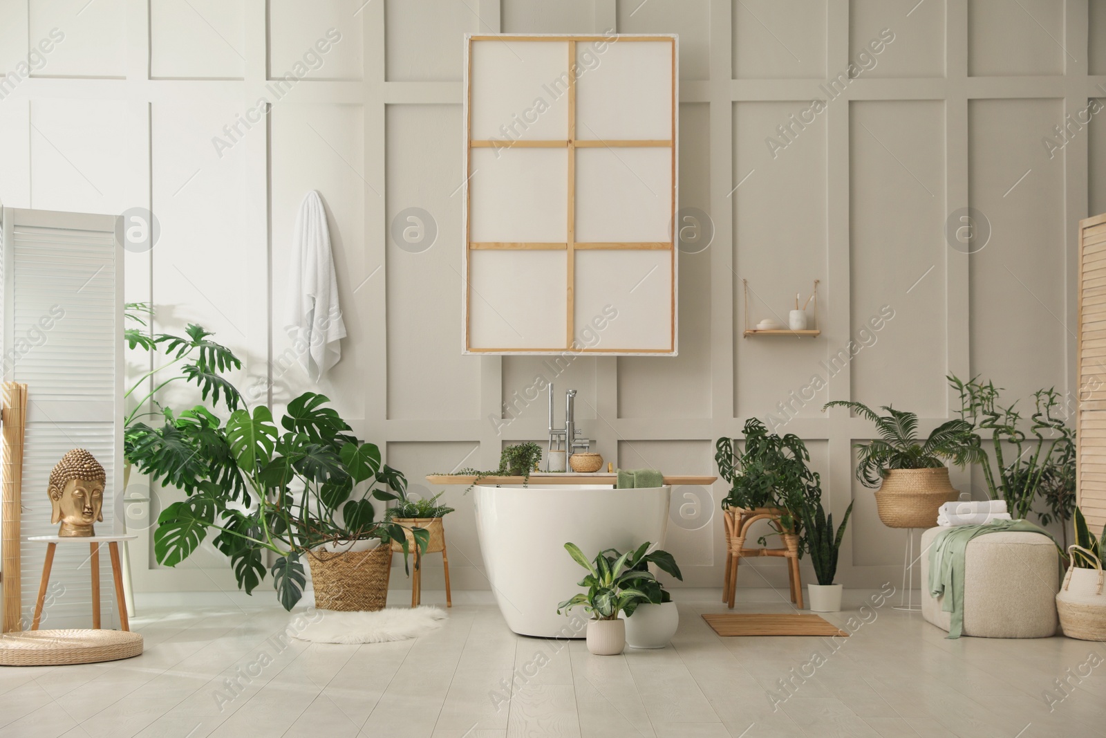 Photo of Stylish bathroom interior with green plants. Home design