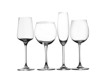 Photo of Set of different glasses isolated on white