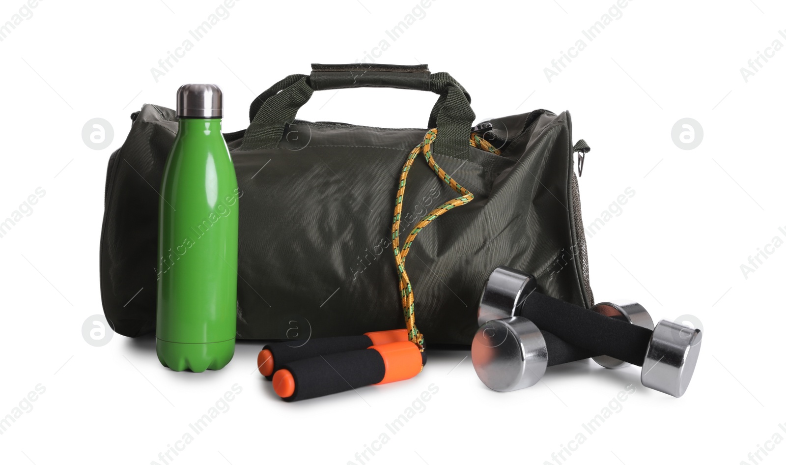 Photo of Sports bag and gym equipment on white background